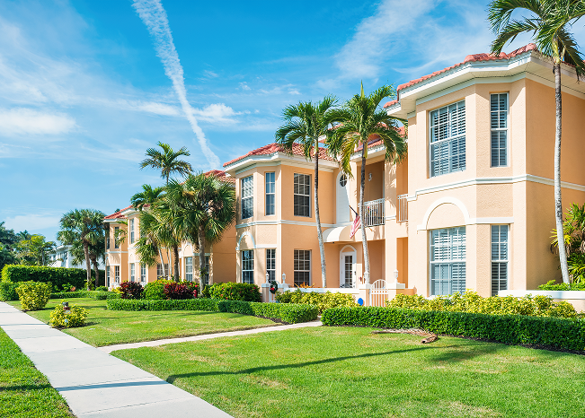 Mediterranean-style buildings with lush landscaping
