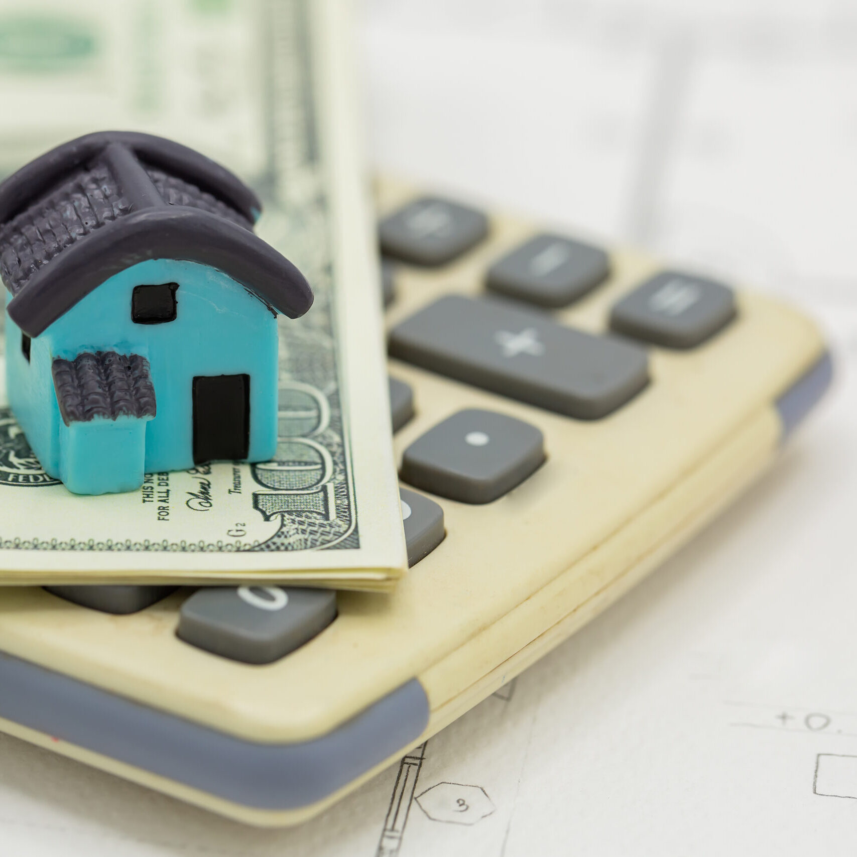 house-calculator-with-dollar-bills